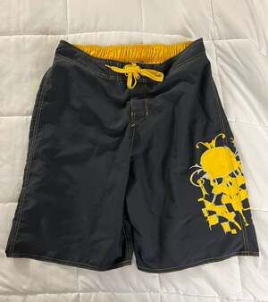 Vintage 2009 Joe Boxer Men's Medium Black and Yellow Skull Graphic Swim Trunks